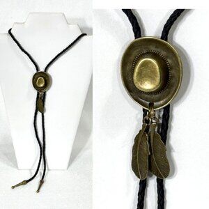 Gold-tone and black cord cowboy hat and feathers bolo tie.